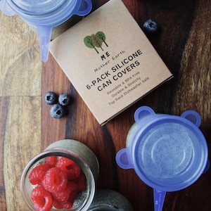 May include: A set of six blue silicone can covers with the text "6-Pack Silicone Can Covers" on a brown box. The box also has the text "ME Mother Earth" and "Reusable & BPA Free, Durable & Stretchy, Top Rack Dishwasher Safe".