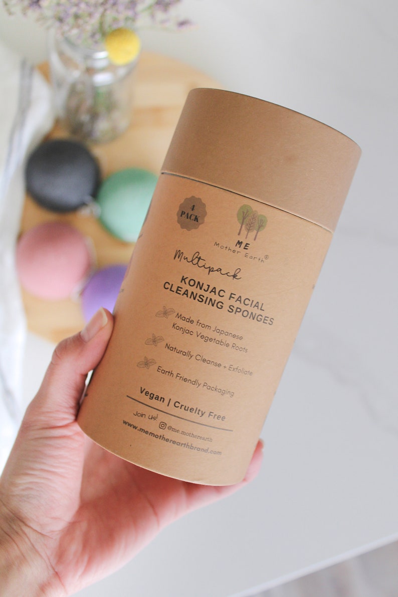 May include: A brown cardboard tube with a white label that says "ME Mother Earth" and "Multipack Konjac Facial Cleansing Sponges". The label also says "Made from Japanese Konjac Vegetable Roots", "Naturally Cleanse + Exfoliate", "Earth Friendly Packaging", "Vegan | Cruelty Free", and "Join us! @me_motherearth www.memotherearthbrand.com".