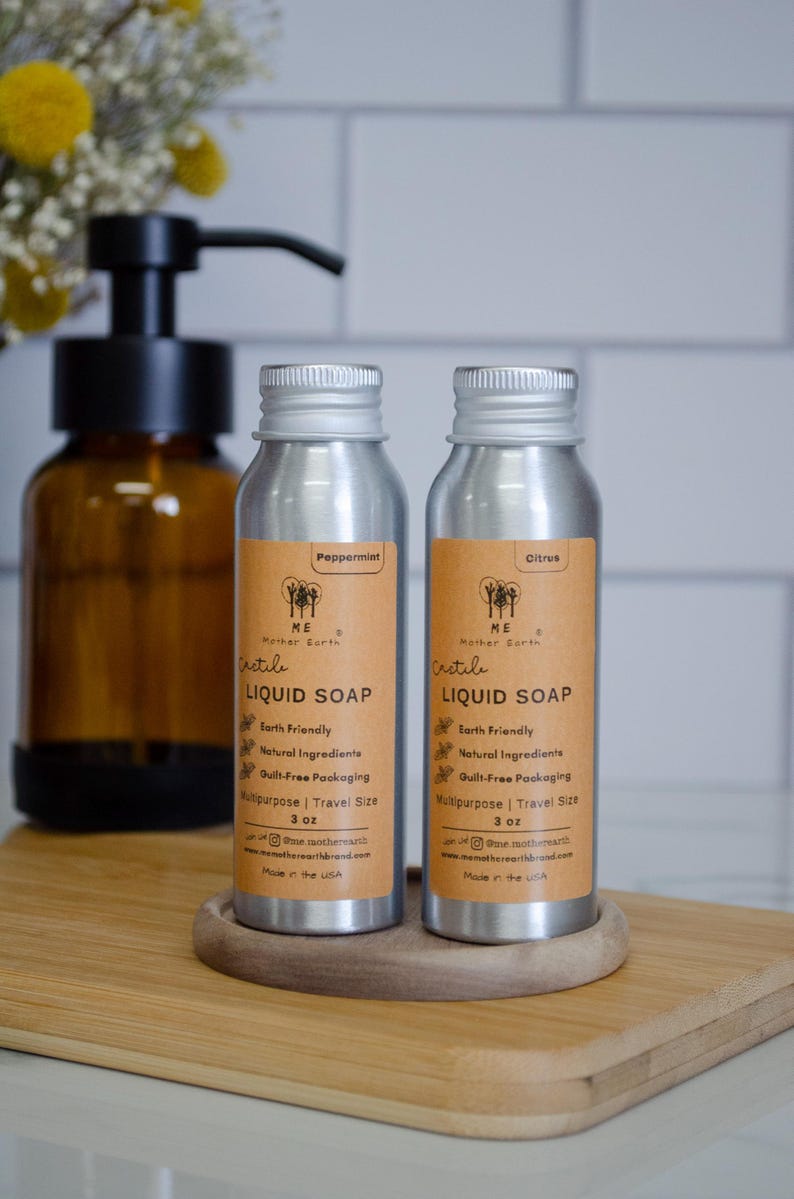 May include: Two silver bottles of Castile liquid soap, one labeled "Peppermint" and the other "Citrus". Both bottles are 3 oz and are labeled "Earth Friendly", "Natural Ingredients", "Guilt-Free Packaging", "Multipurpose | Travel Size", and "Made in the USA".