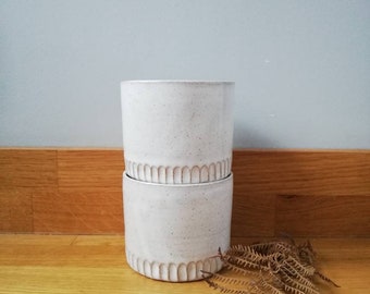 White carved ceramic tumbler beaker