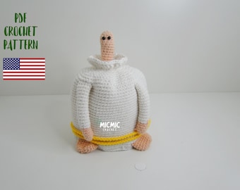 May include: Crochet pattern PDF for a white crocheted worm with a yellow belt and black eyes. The pattern is available for download.