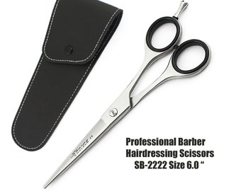May include: Silver-toned stainless steel barber hairdressing scissors with black finger ring inserts and a finger rest, accompanied by a black faux leather storage case. The blade is marked with the text Professional Barber Hairdressing Scissors SB-2222 Size 6.0.