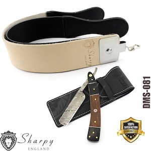 May include: A straight razor and strop set. The razor has a patterned blade and a wooden handle with brass accents. The strop is tan leather with a black backing. The set includes a black leather case. The brand name "Sharpy England" is visible.