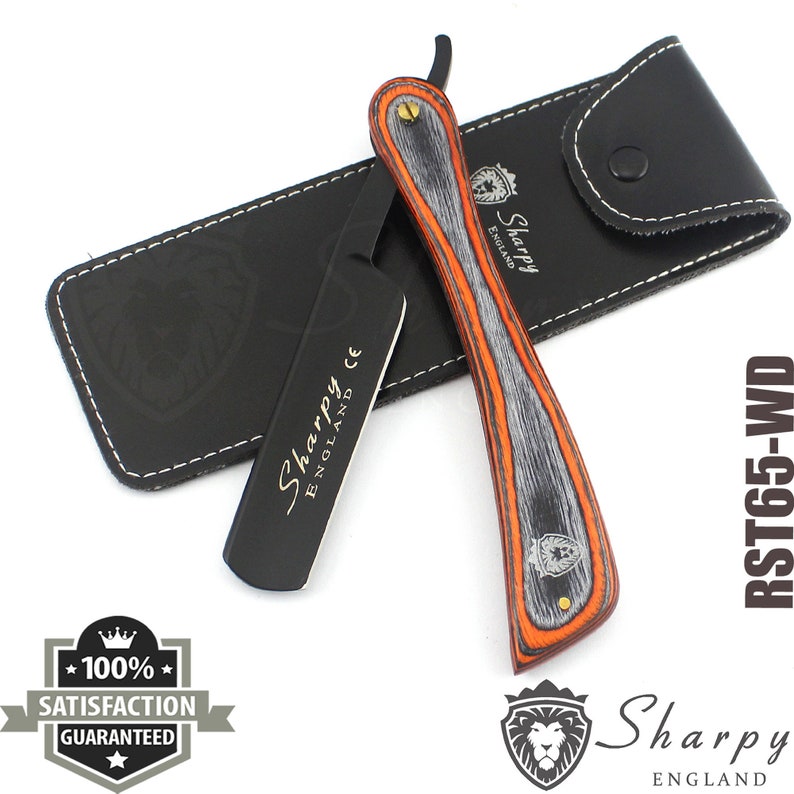 May include: A black and orange straight razor with a wooden handle and a leather case. The razor has the text "Sharpy England" engraved on the blade and the handle. The case has the text "Sharpy England" embossed on it.