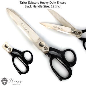 May include: Heavy-duty tailor shears with black handles. The blades are silver and feature the text "Sharpy England CE". The handle size is 12 inches.