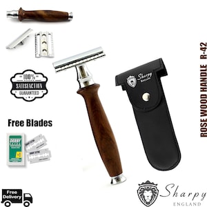 May include: A silver safety razor with a rosewood handle and a black leather case. The razor has a chrome finish and a classic design. The case has the text "Sharpy England" printed on it. The razor comes with free blades.