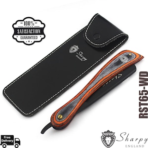 May include: A black leather case with a silver lion logo and the text "Sharpy England" is shown next to a black and orange straight razor with a wooden handle. The razor has the text "Sharpy" on the blade and the text "RST65-WD" on the right side of the image.
