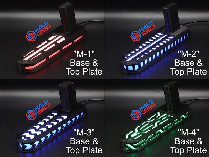 May include: Four black bases with top plates, each illuminated with different colored LED lights: red, blue, white, and green. Each base has the text "HALO MACHINE" and a label: "M-1", "M-2", "M-3", and "M-4".
