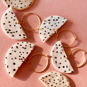 When half moons meet hoop earrings. This is handmade with polymer clay.