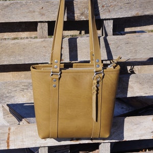 Shoulder bag/purse/bag. Made with Khaki Desert Brown 100 percent rustic full grain leather. Made in the USA.