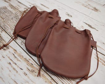 Beautiful rich brown leather drawstring pouch bag. Can be used as gift bag. Made in the USA.