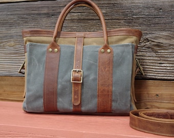 Leather waxed Canvas bag/tote with zipper. Adjustable leather shoulder strap/easy carry handles. 100% cotton lining with pockets. USA Made
