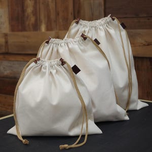 Heavy cotton canvas dust/gift/storage bag. 100 percent cotton canvas. Made in the USA