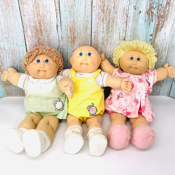 Two left:  Vintage mid-1980's Cabbage Patch Kids, original clothing on some dolls, 2 regular CPK dolls, 1985 CPK doll