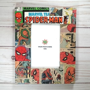 May include: A picture frame made from a vintage Marvel Comics Spider-Man comic book. The frame is 4x6 inches and has a white mat. The comic book cover features Spider-Man in red and blue with the text "Marvel Tea Spider-Man".