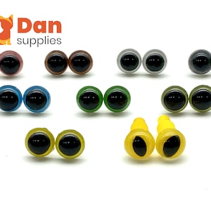May include: Assortment of plastic safety eyes for crafts. The eyes come in a variety of colors, including black, brown, green, blue, yellow, and gray. The eyes are all about 1 inch in diameter.