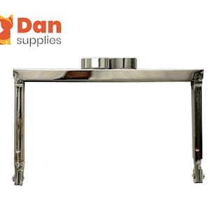 May include: Silver-toned metal purse frame with a round top and two curved legs. The frame is designed to hold a purse or handbag.