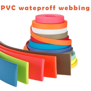 May include: A variety of colors of waterproof PVC webbing. The webbing is arranged in a fan shape with the colors ranging from blue, green, yellow, orange, red, brown, and light blue.