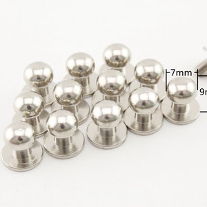 May include: A set of 10 silver-toned metal dome-shaped buttons with a screw-on back. The buttons are 7mm in diameter and 9mm in height.