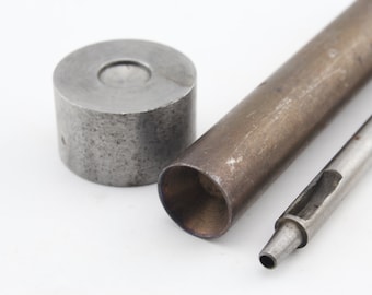 May include: A set of three metal tools for leather crafting. The tools include a round punch, a hollow tube, and a pointed tool.