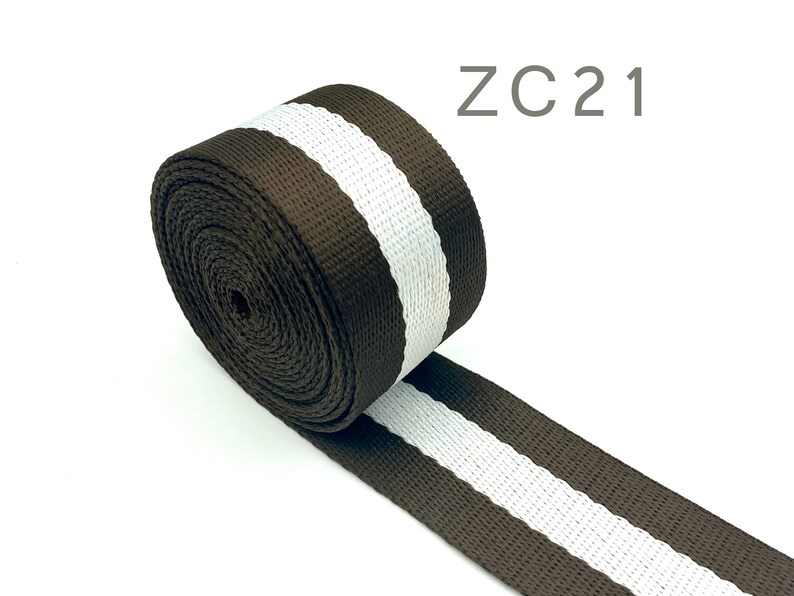 May include: Brown and white striped webbing with the text "ZC21" in the top right corner of the image.