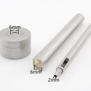 May include: A set of three metal tools for leather crafting. The tools include a 6 mm punch, a 6 mm setting tool, and a 2 mm punch.