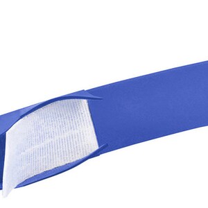 May include: A blue fabric strap with a white hook and loop fastener. The strap is folded in half, showing the inside of the fastener.