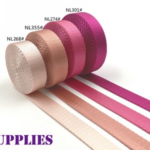 Puede incluir: Cuatro rollos de cinta de color rosa, melocot&oacute;n y beige con el texto "NL268#", "NL355#", "NL274#" y "NL301#" en los rollos. La cinta est&aacute; dispuesta en l&iacute;nea con los rollos en la parte superior y los extremos de la cinta se extienden hacia la derecha. El texto "DAN SUPPLIES" est&aacute; en la parte inferior de la imagen.