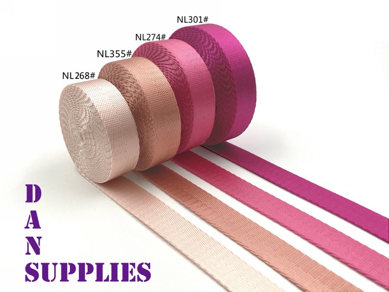 Puede incluir: Cuatro rollos de cinta de color rosa, melocot&oacute;n y beige con el texto "NL268#", "NL355#", "NL274#" y "NL301#" en los rollos. La cinta est&aacute; dispuesta en l&iacute;nea con los rollos en la parte superior y los extremos de la cinta se extienden hacia la derecha. El texto "DAN SUPPLIES" est&aacute; en la parte inferior de la imagen.
