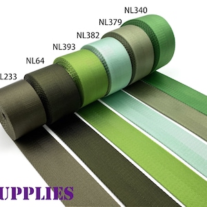 May include: Assortment of green, brown, and light blue webbing straps. The straps are rolled up and labeled with the following product codes: NL233, NL64, NL393, NL382, NL379, and NL340.