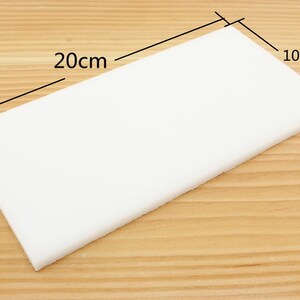 May include: A white rectangular foam sheet measuring 20 inches by 10 inches.