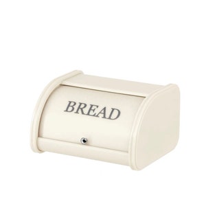 May include: A white ceramic bread bin with a hinged lid and a silver latch. The bin has the word "BREAD" printed on the front.