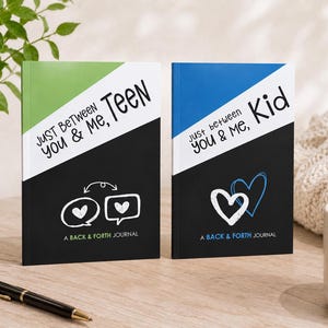 May include: Two rectangular journals with black, white, and colored covers. The left journal is green and white with the text "JUST BETWEEN YOU & ME, TEEN" and speech bubbles. The right journal is blue and white with "JUST BETWEEN YOU & ME, KID" and hearts.