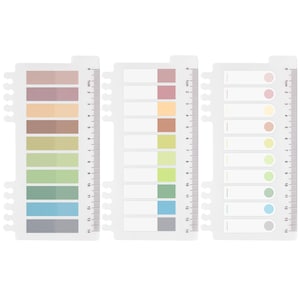 May include: Three white, plastic sticky note sets with a ruler edge. Each set has a different design: one with colored rectangular sticky notes, one with blank rectangular notes, and one with colored circular notes. The sets measure up to 14 cm.