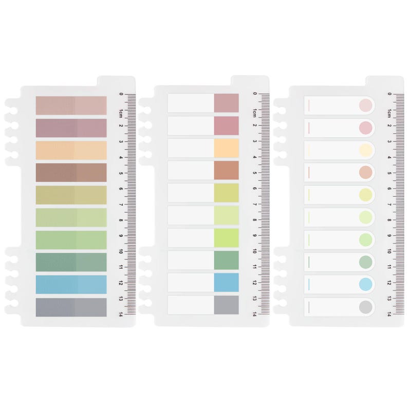May include: Three white, plastic sticky note sets with a ruler edge. Each set has a different design: one with colored rectangular sticky notes, one with blank rectangular notes, and one with colored circular notes. The sets measure up to 14 cm.