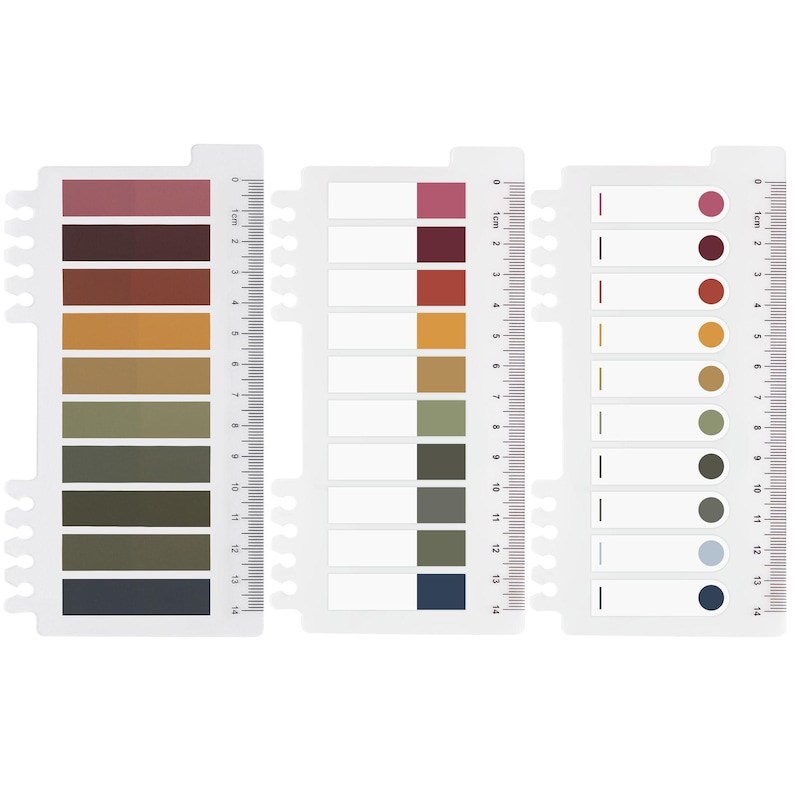 May include: Three white color swatch cards with a ruler edge. The cards display a variety of color swatches in shades of red, brown, orange, green, and blue. Each card has a different design, with some featuring rectangular blocks and others circles.