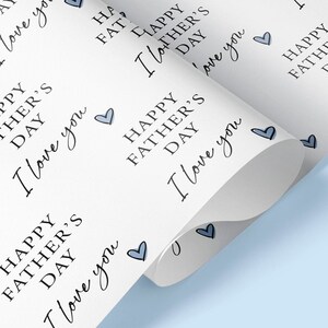 May include: White wrapping paper with a repeating pattern of blue hearts and the text "Happy Father's Day I love you".