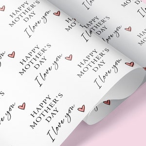 May include: White wrapping paper with a repeating pattern of pink hearts and the text "Happy Mother's Day I love you".