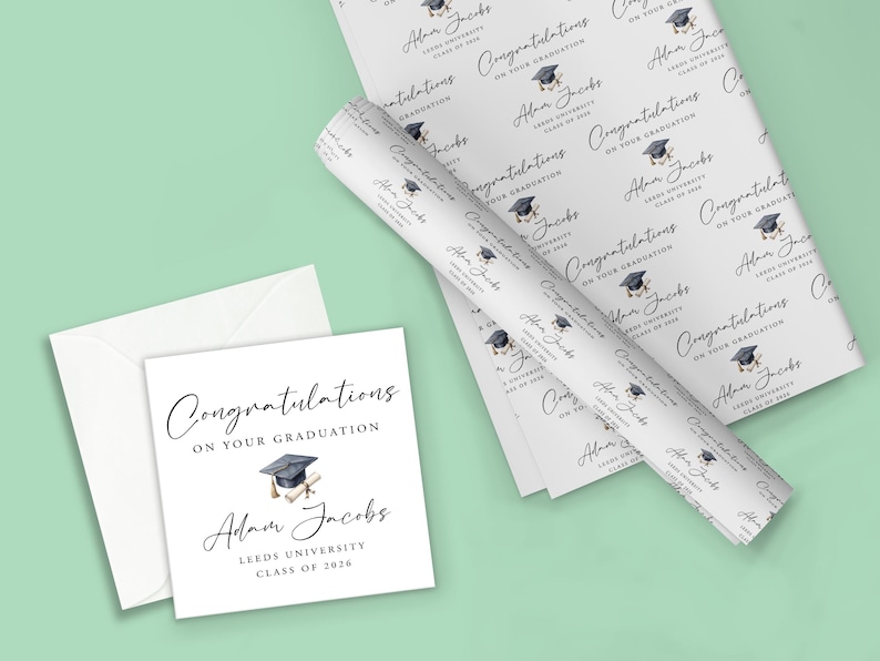 May include: A graduation-themed stationery set featuring a greeting card, envelope, and wrapping paper. The card and paper are white with the text "Congratulations on Your Graduation" and the graduate's name, school, and class year. The design includes a mortarboard.