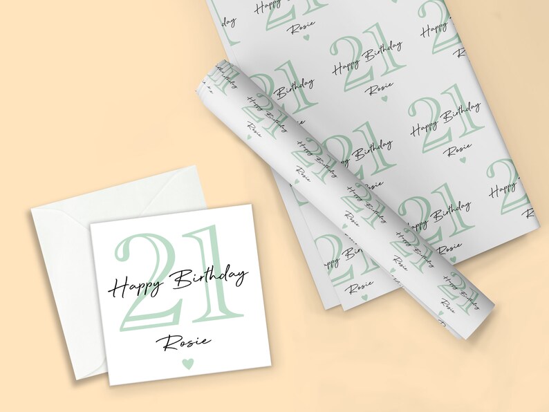 May include: A birthday-themed set featuring a greeting card, envelope, and wrapping paper. The design includes the number "21", the words "Happy Birthday", and the name "Rosie" in a soft green and black color scheme.