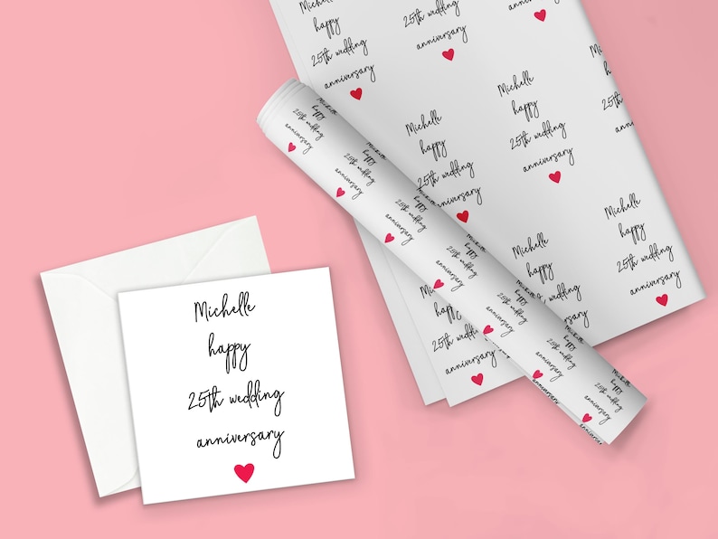 May include: White wrapping paper with a repeating pattern of the text "Michelle happy 25th wedding anniversary" and a small red heart. A white card with the same text and a red heart is shown next to the wrapping paper.