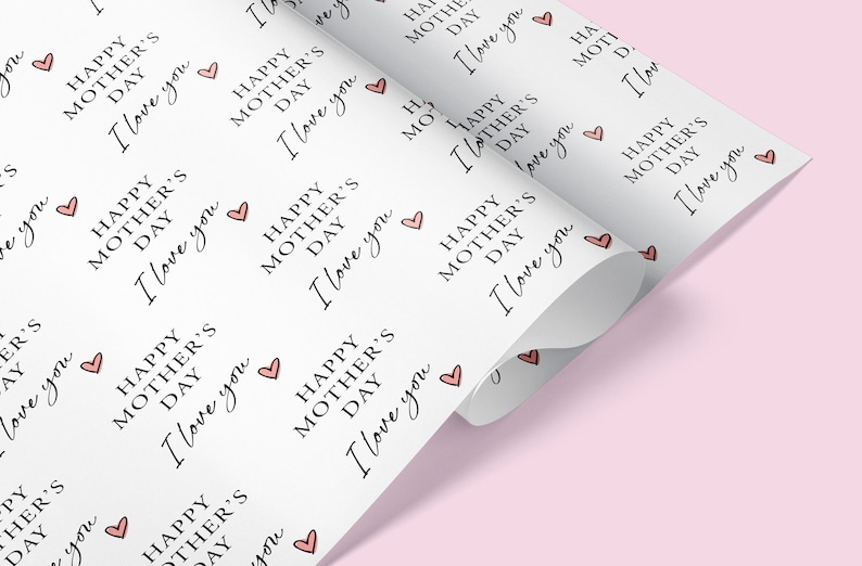 May include: White wrapping paper with a repeating pattern of pink hearts and the text "Happy Mother's Day I love you".