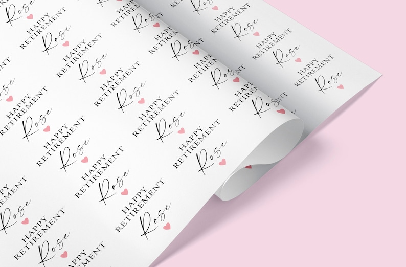 May include: White wrapping paper with a repeating pattern of the text "Happy Retirement" and the name "Rose" in cursive script. Each pattern is accompanied by a small pink heart.
