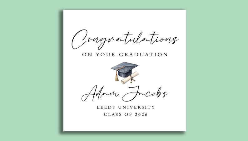 May include: A white graduation card with elegant script that reads "Congratulations on Your Graduation." A watercolor illustration of a graduation cap and diploma is centered. The card is personalized with a name, university, and class year.