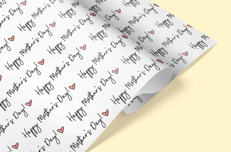 May include: White wrapping paper with a repeating pattern of pink hearts and the text "Happy Mother's Day!" in black cursive.