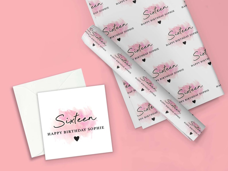 May include: Pink and white wrapping paper with a watercolor design and the text "Sixteen Happy Birthday Sophie". The paper is rolled up and there is a white card with the same design and text.