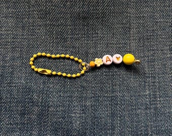 Six the Musical inspired keyring - yellow A, green B, white S etc.