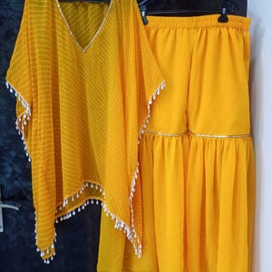Indian Woman Dress
Womens Yellow Sharara
Indian Clothing for Women
Indian Suits for Women
Indian Office Wear
Peplum Top Sharara
Bollywood Outfit for Women
Women Indian Clothing
Palazzo for Women
Palazzo Crop Top
Ethnic Wear for Women
Shalwar Kameez