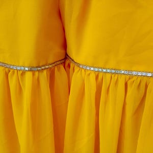 Ready to Wear Sharara
Designer Indian Dress
Mirror Work Shalwar Kameez
Mustard Indian Outfit
Woman Indian Outfit
Custom Indian Clothing
Yellow Dress for Haldi  Plus Size Sharara
Heavy Stone Work
White Gharara
Woman Indian Outfit
Peplum Top Sharara