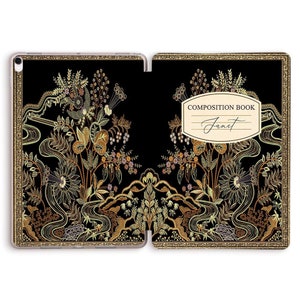 May include: A black composition book with a gold border and intricate floral design. The cover features the text "COMPOSITION BOOK" and the name "Janet".